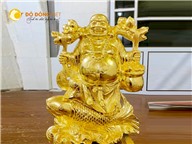 Tượng Phật Di Lặc cưỡi cá chép gánh tiền vàng 
